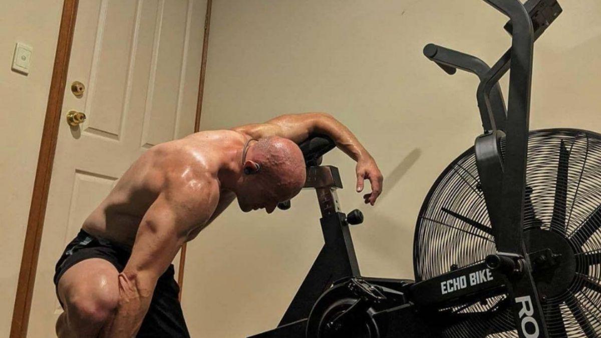 man tired after using air bike