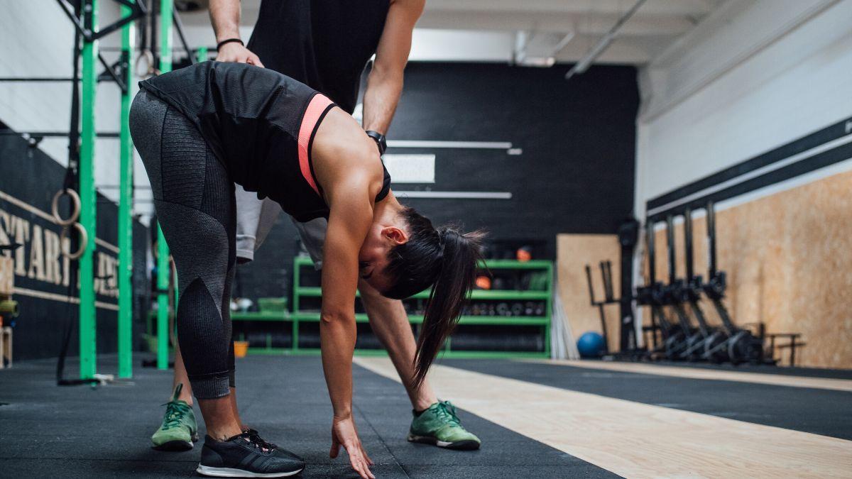 A person stretching before a CrossFit workout.