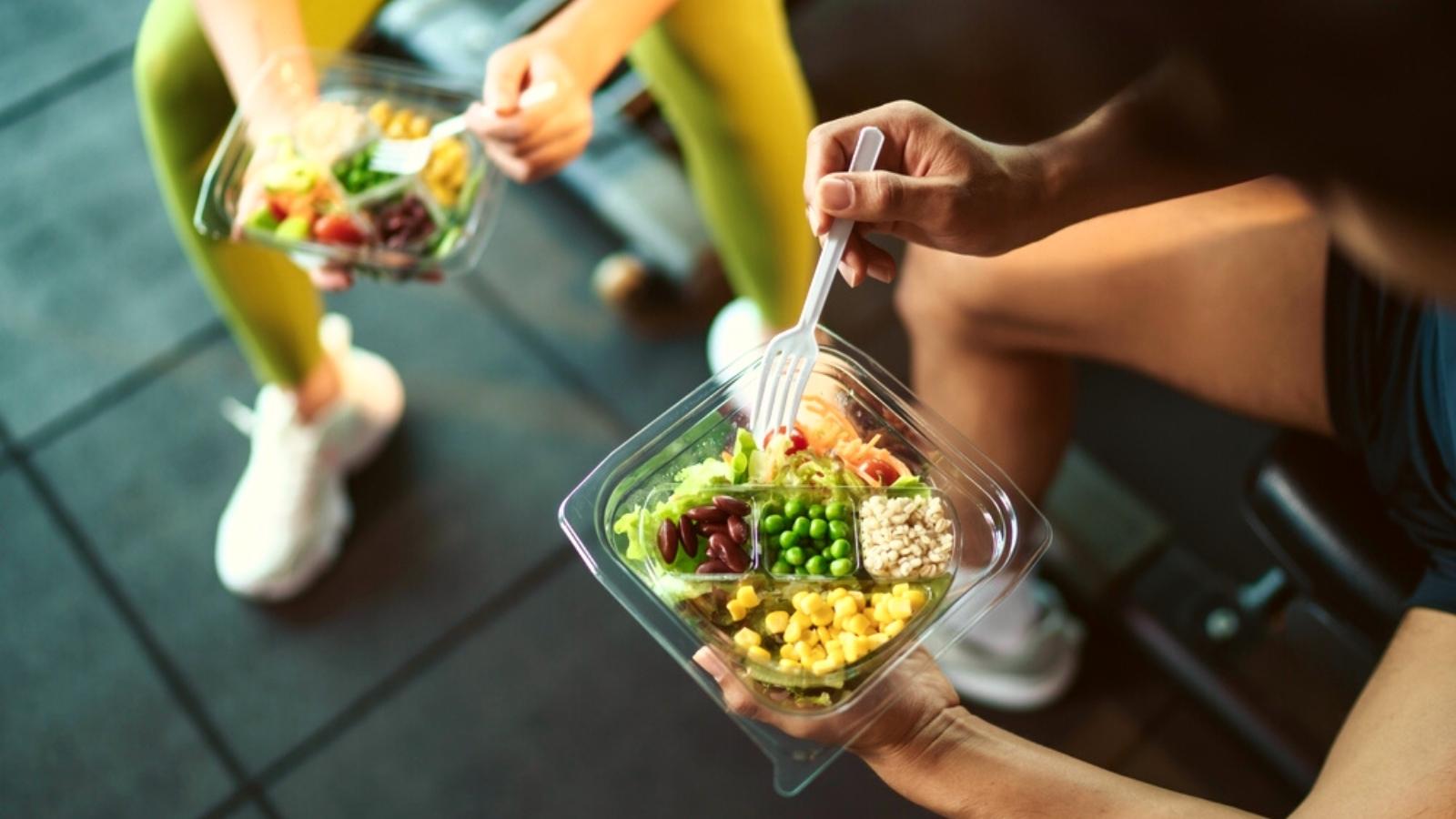 Crossfitters eating at the gym.