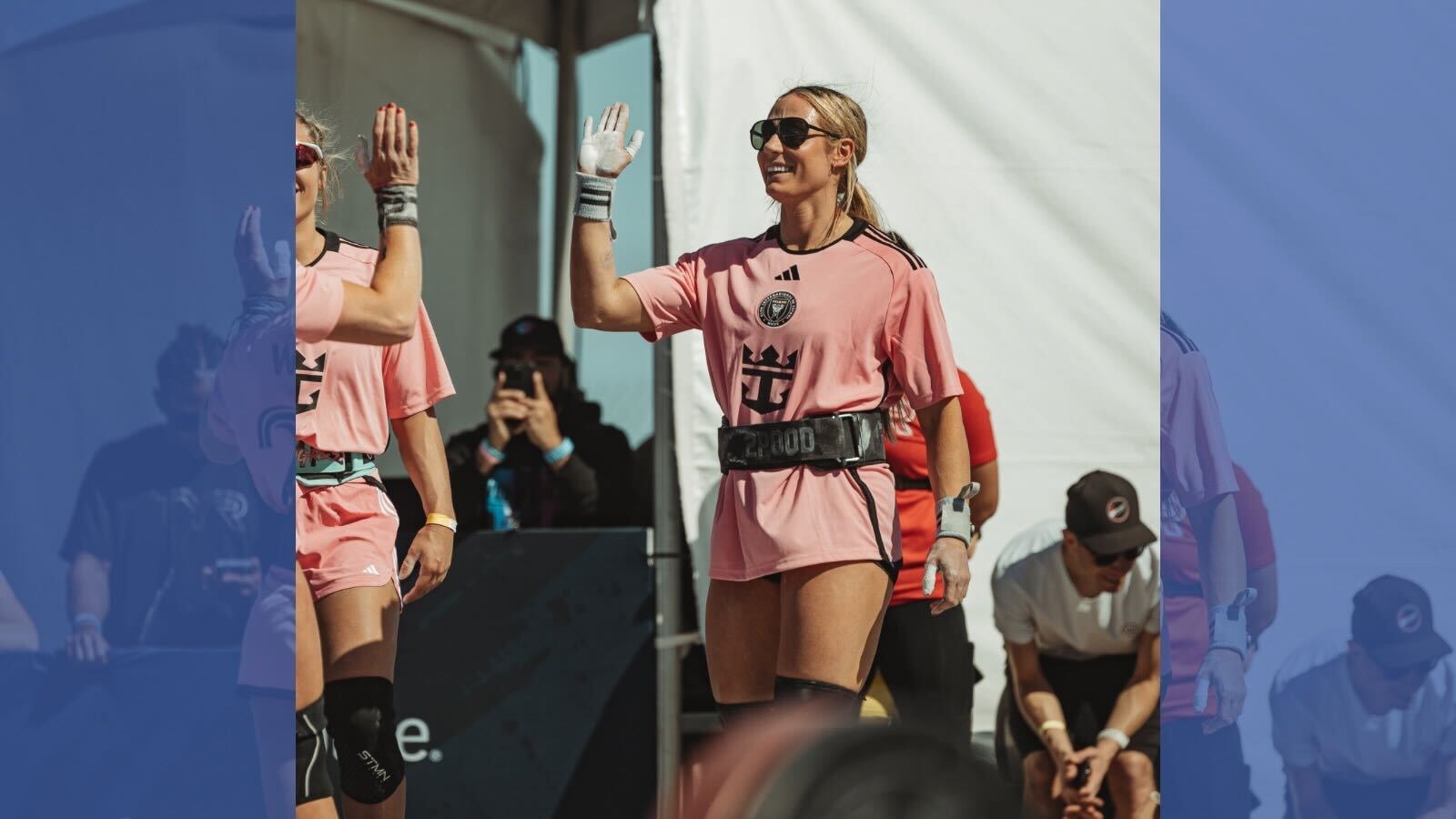 Sydney Wells giving a high-five after a competition.
