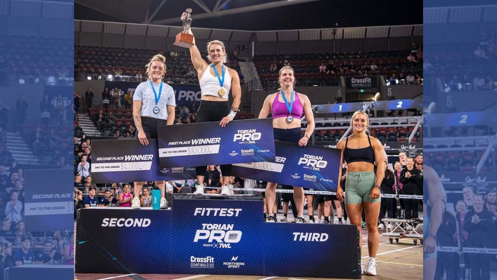 Winners of the Torian Pro stand on a pedestal.